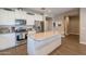 Bright kitchen features granite countertops, stainless steel appliances, and a spacious center island at 29481 W Mitchell Ave, Buckeye, AZ 85396