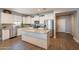 Open kitchen with a large island, granite countertops, and stainless steel appliances at 29481 W Mitchell Ave, Buckeye, AZ 85396
