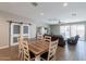 Bright open floor plan featuring dining area, sliding barn doors, and living room at 29481 W Mitchell Ave, Buckeye, AZ 85396