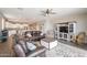 Open-concept living room flows into the kitchen, featuring modern decor and comfortable seating at 29481 W Mitchell Ave, Buckeye, AZ 85396