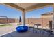 Covered patio featuring outdoor seating and play area in the backyard at 29481 W Mitchell Ave, Buckeye, AZ 85396