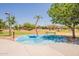 Playground with a splashpad feature with a palm tree themed sprinkler and shade trees at 29481 W Mitchell Ave, Buckeye, AZ 85396