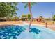 Community playground featuring a splash pad, playground and shade structure at 29481 W Mitchell Ave, Buckeye, AZ 85396