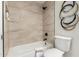 This bathroom features a shower over tub and modern black and gold wall art at 3050 E Cholla E St, Phoenix, AZ 85028