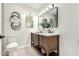 This bathroom features double sinks, a modern vanity, decorative wall art and lots of light at 3050 E Cholla E St, Phoenix, AZ 85028