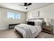 Cozy bedroom featuring a well-lit window, light color scheme and a plush bed with stylish throw pillows at 3050 E Cholla E St, Phoenix, AZ 85028
