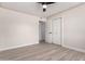 This bedroom features a spacious closet, wood-look tile floors and a modern ceiling fan at 3050 E Cholla E St, Phoenix, AZ 85028