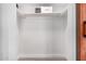 Walk-in closet offering storage with clean white shelving and wood-look floors ready for your belongings at 3050 E Cholla E St, Phoenix, AZ 85028