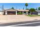 Lovely ranch-style home with a well-kept lawn and a spacious driveway at 3050 E Cholla E St, Phoenix, AZ 85028