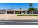 Charming single-story home featuring a well-manicured yard and a two-car garage at 3050 E Cholla E St, Phoenix, AZ 85028