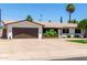 Single-Gathering home with mature trees and lush landscaping at 3050 E Cholla E St, Phoenix, AZ 85028