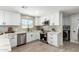 Modern kitchen featuring white cabinets, stainless appliances, and tiled backsplash at 3050 E Cholla E St, Phoenix, AZ 85028