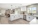 Bright, modern kitchen with white cabinetry, quartz countertops, and stainless steel appliances at 3050 E Cholla E St, Phoenix, AZ 85028