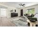 Well-decorated living room with a decorative ceiling fan and neutral color palette at 3050 E Cholla E St, Phoenix, AZ 85028