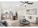 Inviting living area flowing into kitchen with barstool seating, perfect for entertaining, with decoratively neutral tones at 3050 E Cholla E St, Phoenix, AZ 85028