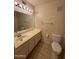 Neutral bathroom with a large vanity and tile flooring at 3328 E Crescent Ave, Mesa, AZ 85204