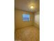 The bright bedroom has tile floor and a window at 3328 E Crescent Ave, Mesa, AZ 85204