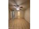 A bedroom features a ceiling fan and tile floors at 3328 E Crescent Ave, Mesa, AZ 85204