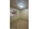 The bedroom has tile floor and a window at 3328 E Crescent Ave, Mesa, AZ 85204