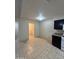 Bright kitchen with adjacent laundry room, perfect for efficient chores at 3328 E Crescent Ave, Mesa, AZ 85204
