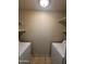 A convenient laundry room features built-in shelving for storage at 3328 E Crescent Ave, Mesa, AZ 85204