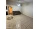 Bright living room featuring ceramic flooring that connect to the kitchen areas at 3328 E Crescent Ave, Mesa, AZ 85204