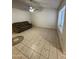 Bright living room featuring ceramic flooring, a ceiling fan and a large window at 3328 E Crescent Ave, Mesa, AZ 85204