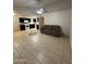 Bright living room featuring tile flooring and a ceiling fan at 3328 E Crescent Ave, Mesa, AZ 85204