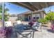Beautiful backyard patio with comfortable seating, a cozy fire pit, and a relaxing atmosphere at 36076 W Santa Barbara Ave, Maricopa, AZ 85138