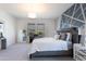 Inviting main bedroom with stylish decor, plush carpet, and lots of natural light at 36076 W Santa Barbara Ave, Maricopa, AZ 85138