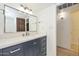Bathroom vanity features a blue cabinet, white countertop, and modern fixtures at 3637 E Monterosa St # 8, Phoenix, AZ 85018
