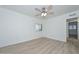 Clean bedroom with updated wood-look floors, white walls and trim, and a modern ceiling fan at 3637 E Monterosa St # 8, Phoenix, AZ 85018