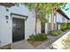 View of units with black doors and attractive desert landscaping and accents at 3637 E Monterosa St # 8, Phoenix, AZ 85018