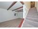 Large open living room with exposed beams and staircase at 3637 E Monterosa St # 8, Phoenix, AZ 85018