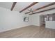 Bright and airy living room with beamed ceilings and attractive wood-look tile floors at 3637 E Monterosa St # 8, Phoenix, AZ 85018