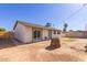 View of the back of the home and yard featuring mature landscaping at 3812 W Seldon Ln, Phoenix, AZ 85051
