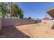 Fenced backyard featuring dirt landscaping and mature shade trees at 3812 W Seldon Ln, Phoenix, AZ 85051