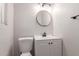 Clean bathroom features new lighting, vanity and toilet at 3812 W Seldon Ln, Phoenix, AZ 85051