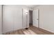 This bedroom features wood-look flooring and ample closet space at 3812 W Seldon Ln, Phoenix, AZ 85051