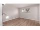 Inviting bedroom with wood-look floors, a brick accent wall, and plenty of natural light at 3812 W Seldon Ln, Phoenix, AZ 85051