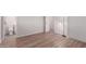 Cozy bedroom space features wood-look flooring, fresh paint, and closet space at 3812 W Seldon Ln, Phoenix, AZ 85051
