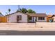 Inviting single-story home featuring desert landscaping, updated windows and a welcoming front entrance at 3812 W Seldon Ln, Phoenix, AZ 85051