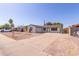 View of house with desert landscaping, long driveway, and two-car garage at 3812 W Seldon Ln, Phoenix, AZ 85051