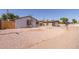 Exterior view of home, showcasing desert landscaping, wood fence, and a well-maintained exterior at 3812 W Seldon Ln, Phoenix, AZ 85051