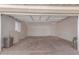 Spacious two car garage with white walls and automatic overhead door at 3812 W Seldon Ln, Phoenix, AZ 85051