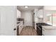 Updated kitchen showcasing stainless appliances, granite counters, and new cabinets at 3812 W Seldon Ln, Phoenix, AZ 85051