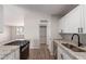 Open kitchen layout boasts granite counters, stainless steel appliances, and ample cabinet space at 3812 W Seldon Ln, Phoenix, AZ 85051