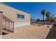 Single-Gathering home's backyard with stone pavers, desert landscaping, and mature trees at 3952 E Baywood Ave, Mesa, AZ 85206
