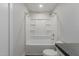 Full bathroom featuring a shower-tub combo, toilet, and white fixtures at 3952 E Baywood Ave, Mesa, AZ 85206