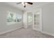 Bedroom with neutral carpet, and glass paneled french doors to an adjacent room at 3952 E Baywood Ave, Mesa, AZ 85206